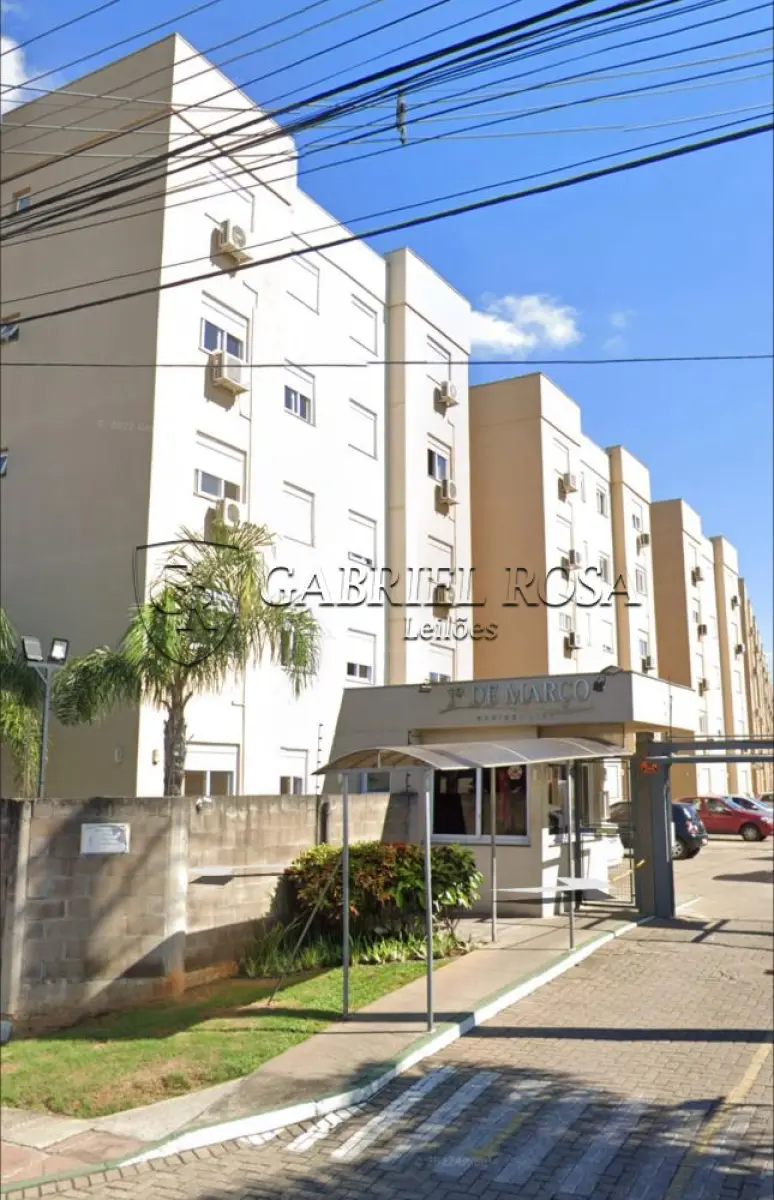 LOTE 002 - O apartamento nº 203, Torre 18, Topázio, do Condomínio Residencial 1º de Março, com a área privativa de 57,0912 m², área de uso comum de 15,2384 m², área total de 72,3296 m², endereço Rua Lopes Trovão, nº 333, Bairro Industrial, Novo Hamburgo/RS. Imóvel de matrícula 104.481