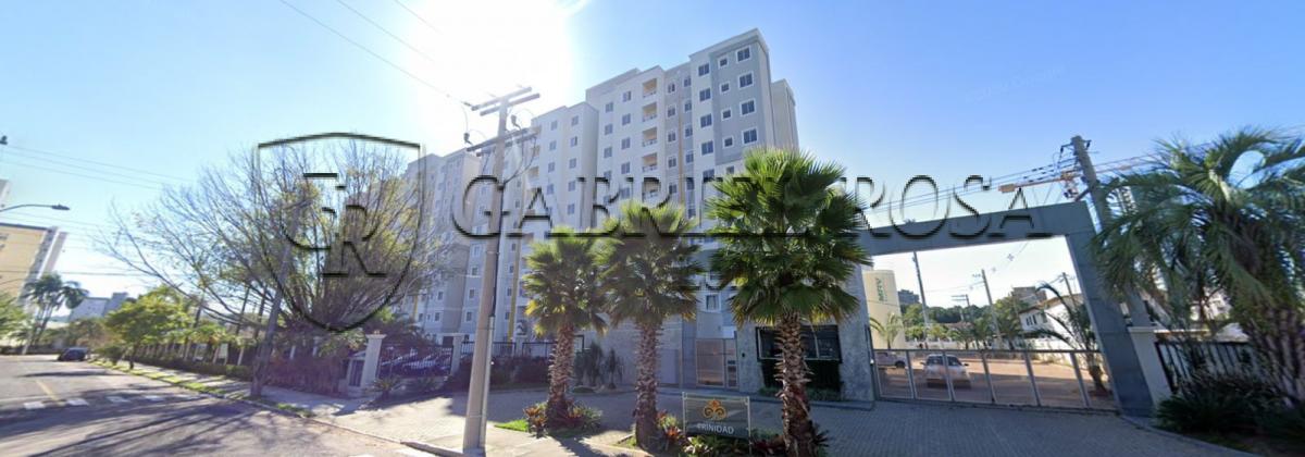 Apartamento nº 405, da Torre 01, do Condomínio Porto Trinidad, com área real privativa de  46,91 m², e o Box nº 189, com área de 11,52 m², descoberta livre. Situado na Rua Avaí, nº 119, Bairro Vila Rosa, Novo Hamburgo/RS. Registrado sob matrícula nº 121.760