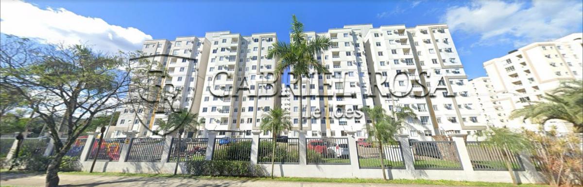 Apartamento nº 405, da Torre 01, do Condomínio Porto Trinidad, com área real privativa de  46,91 m², e o Box nº 189, com área de 11,52 m², descoberta livre. Situado na Rua Avaí, nº 119, Bairro Vila Rosa, Novo Hamburgo/RS. Registrado sob matrícula nº 121.760