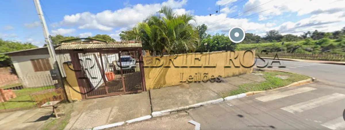 LOTE 003 - Casa com 02 domitórios, espaço de cozinha e sala integrados, 01 banheiro, 01 sala pequena, lavanderia e garagem coberta, e o respectivo terreno com área  superficial de 420 m², situada na Rua Curitiba, nº 2042, Bairro Mathias Velho, Canoas/RS. Registrado sob matrícula 41.867