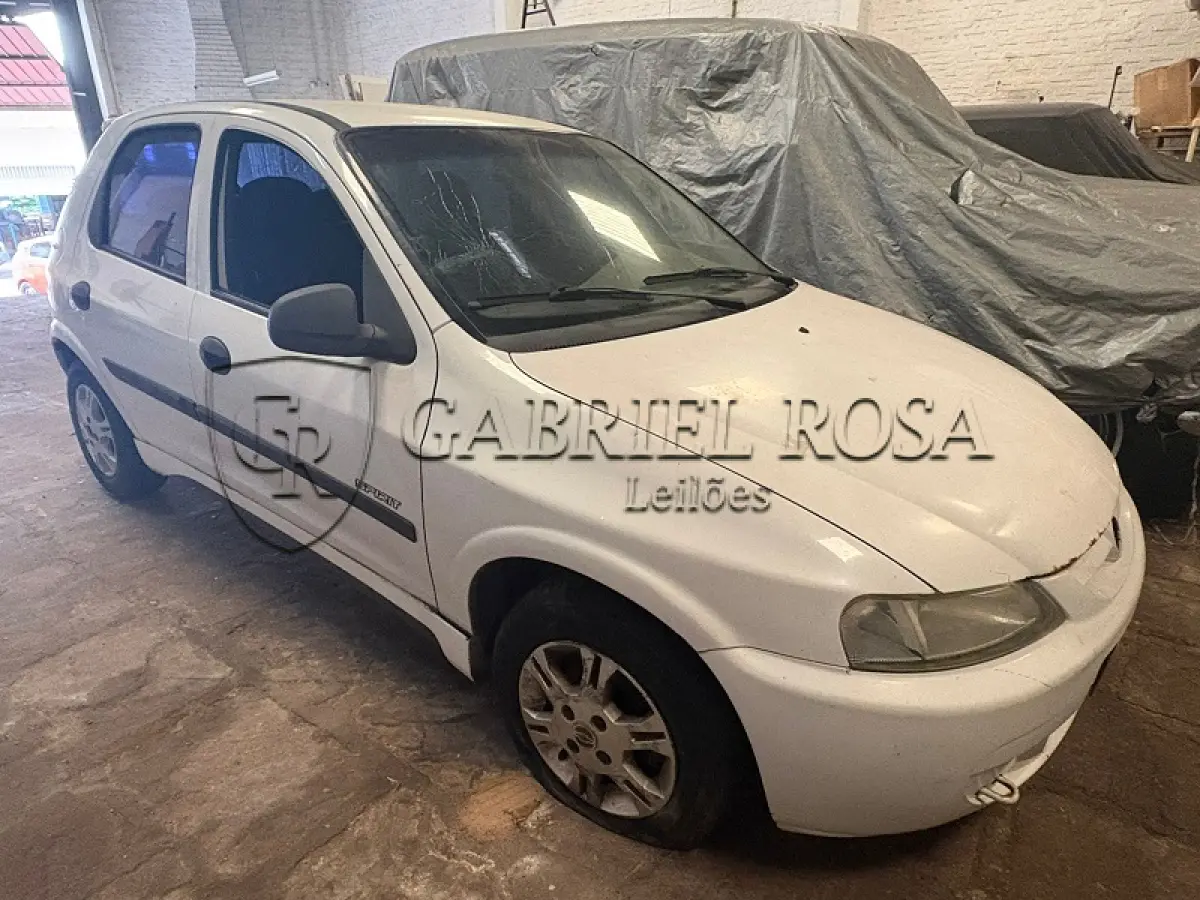 LOTE 002 - Chevrolet Celta 4P Spirit Flex, Ano/Modelo: 2005/2006, Cor: Branca, Placa: IMV4697