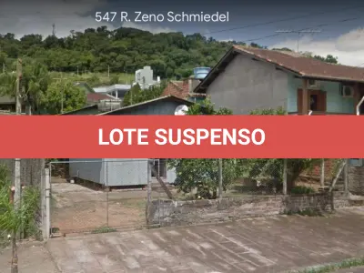 LOTE 004 - Terreno com aproximadamente 360m², com 02 construções não averbadas, situado na Rua Zeno Schmiedel, nº 547, Bairro Floresta, Estância Velha. Registrado sob matrícula 2299