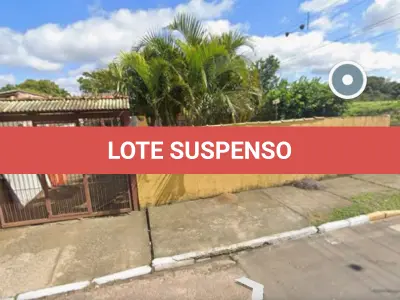 LOTE 003 - Casa com 02 domitórios, espaço de cozinha e sala integrados, 01 banheiro, 01 sala pequena, lavanderia e garagem coberta, e o respectivo terreno com área  superficial de 420 m², situada na Rua Curitiba, nº 2042, Bairro Mathias Velho, Canoas/RS. Registrado sob matrícula 41.867