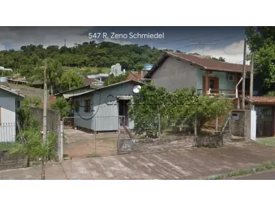 LOTE 003 - Terreno com aproximadamente 360m², com 02 construções não averbadas, situado na Rua Zeno Schmiedel, nº 547, Bairro Floresta, Estância Velha. Registrado sob matrícula 2299