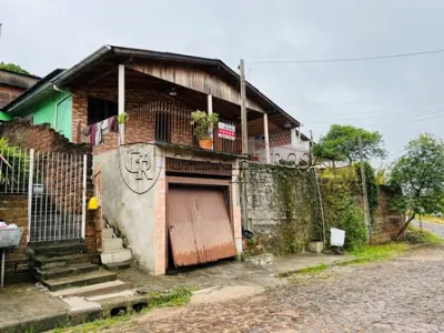 LOTE 003 - UM TERRENO, SITUADO NA ZONA ESPECIAL DE INTERESSE SOCIAL 2 (ZEIS 2), BAIRRO RINCÃO DOS ILHÉUS EM ESTÂNCIA VELHA - RS, COMPOSTO DO LOTE 05 DA QUADRA N DO LOTEAMENTO ALTO DA COLINA,  COM UMA RESIDENCIA DE ALVENARIA COM A ÁREA DE 24,30M2, NA RUA MARIA JULIA TREIN Nº 15.