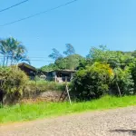 LOTE 012 - UM IMÓVEL COM A ÁREA SUPERFICIAL DE 751,27M2,  COM  UMA CASA RESIDENCIAL DE MADEIRA