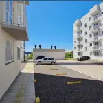 LOTE 002 - Apartamento nº 101, do Bloco I, localizado no pavimento térreo, com área real privativa de 44,9746 m², e a Vaga de Estacionamento descoberta nº 137, do Condomínio Blumen Residence, situado na Rua Celestino Killing, nº 100, Bairro Santo Afonso, Novo Hamburgo/RS. Registrado sob matrícula nº 129.060