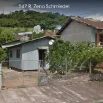 LOTE 004 - Terreno com aproximadamente 360m², com 02 construções não averbadas, situado na Rua Zeno Schmiedel, nº 547, Bairro Floresta, Estância Velha. Registrado sob matrícula 2299